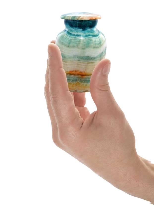 Small Size Cremation Keepsake Urn holding by A Man in his hands