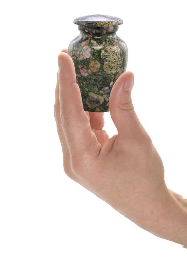 Man Holding Small Sized Emerald Marinace Keepsake Urn in his hands