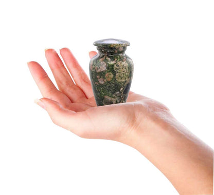 A Man holding in hand Emerald Marinace Keepsake Urn 