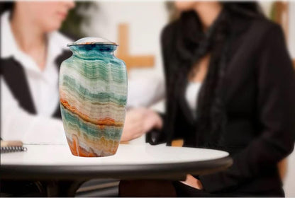 Small Marble Finish Cremation Urn on A Table