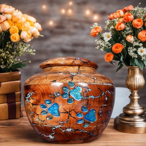 Engraved Wooden Cremation URN placed between flower flock's