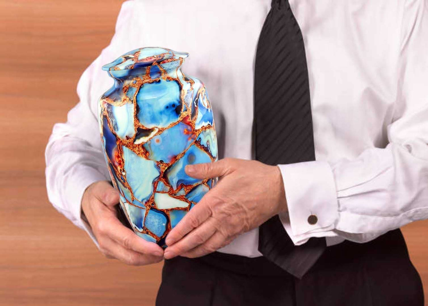 A man holding Cremation Urn